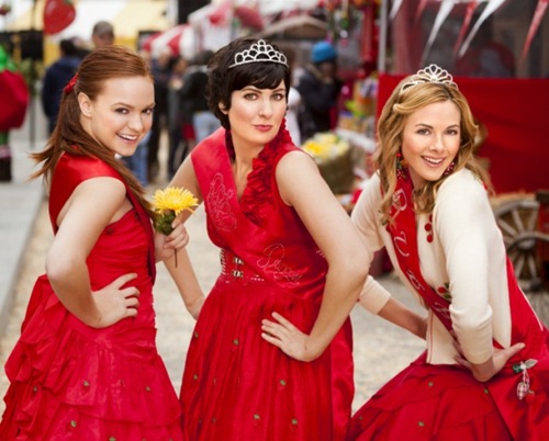 Strawberry Festival Queen Beth Landon (Julie Mond, right) and her Princesses Kara (Michelle DeFraites, left) and Tracy (Dagney Kerr, center) are happy to take part in all the events at their annual festival.
Photo:  Copyright 2012 Crown Media Holdings, Inc./Photographer Alexx Henry 