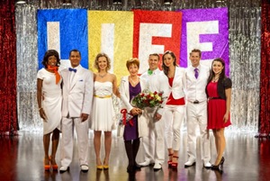 A high school class (left to right: Rukiya Bernard, Peter-John Prinsloo, Emilie Ullerup, Shawn Roberts, Moneca Delain, Kerry James and Nicole Munoz) reunites after 16 years to put on a musical in support of their beloved music teacher Alyson (EmmyÃ?Â® and Golden GlobeÃ?Â® Award nominee Annie Potts, center). 
Photo:  Copyright 2012 Crown Media Holdings, Inc./Photographer Katie Yu