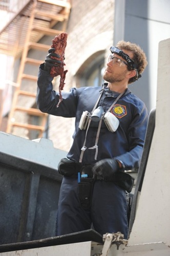 BONES:  Hodgins (TJ Thyne) investigates remains found in a city garbage can in "The Method in the Madness" episode of BONES airing Monday, Nov. 5 (8:00-9:00 PM ET/PT) on FOX.  ©2012 Fox Broadcasting Co.  Cr:  Ray Mickshaw/FOX