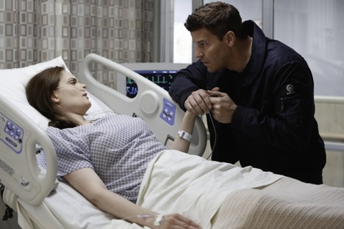 BONES:  Booth (David Boreanaz, R) is worried about Brennan's (Emily Deschanel, L) condition after she is shot while working late at the Jeffersonian lab in the "The Shot in the Dark" episode of BONES airing Monday, Feb. 11 (8:00-9:00 PM ET/PT) on FOX.  ©2013 Fox Broadcasting Co. Cr: Jordin Althaus/FOX