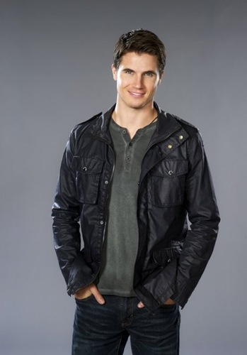 Robbie Amell stars as Paxton Flynn, who along with his younger brother discover they come from a long line of Hunters and realize they must assume their birthright and find their missing parents and the magical mirror before it's too late.  Photo: Copyright 2013 Crown Media, Inc./Photographer Diyah Pera 