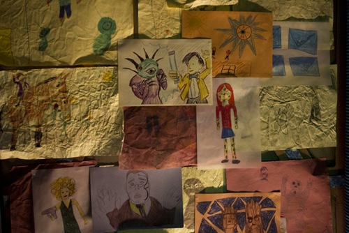 Picture shows: A wall of art featuring The Doctor and some of his friends and foes.